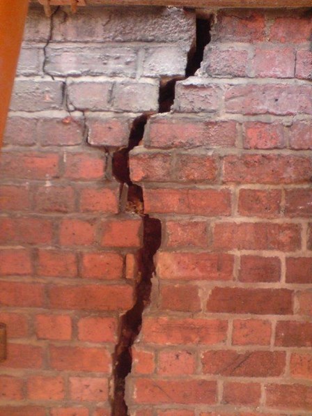 Significant structural crack in the brick wall, caused by settlement of the foundations, required crack stitching, at The Ulster Hall, Belfast, Co. Antrim, Northern Ireland