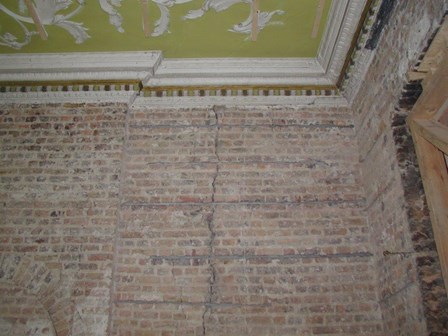 Vertical cracks in brick wall, with helical crack stitching bars evident, O'Connell St, Dublin, Ireland