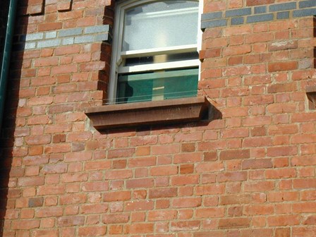 Discreet bird wire installed on window ledges at Portrush Town Hall, Co. Antrim, Northern Ireland.
