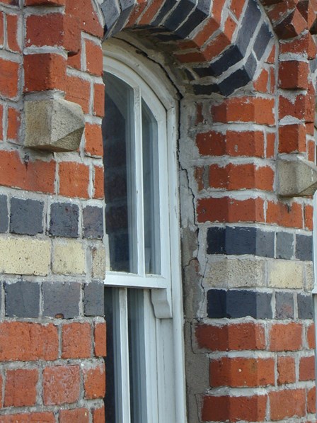 Replacement wall ties required.  Brickwork cracking around window arches, at Magilligan, Co. Londonderry, NI