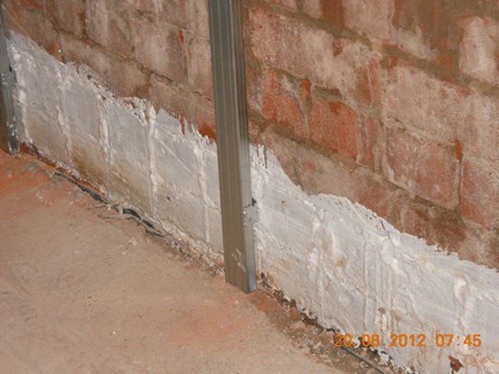 Tanking, Belfast. Tanking was applied to the walls below the level of the damp proof course